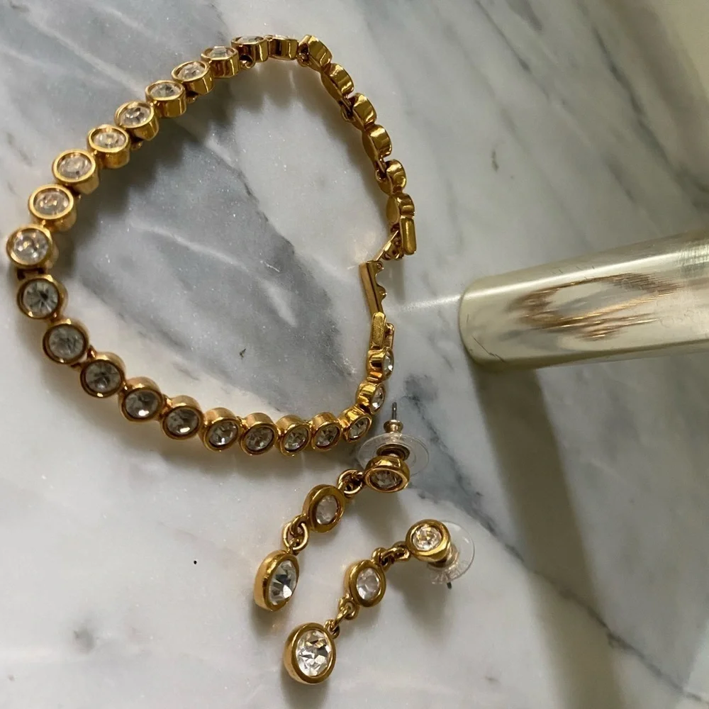 𝅺swarovski gold tone clear crystal earrings and 7” bracelet set